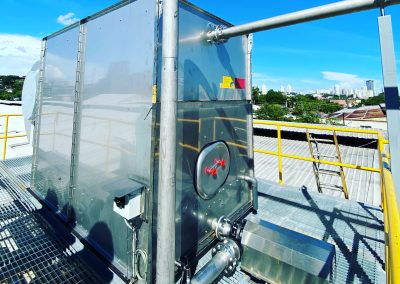 A large metal structure with a yellow railing.